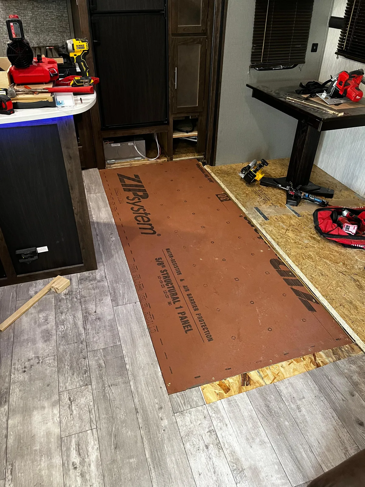 Roadwise RV technician fixing the floor after a water leak inside an RV